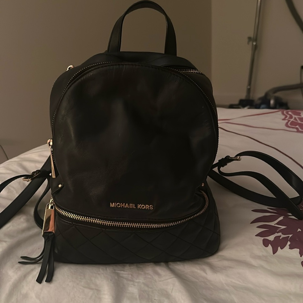 Beautiful easy to carry Michael Kors Navy Blue leather back pack
